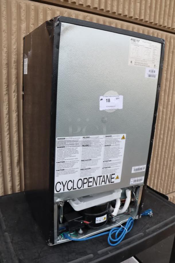 Danby 3.1MF7-7B1 MicroFridge, 3.1 cu. ft., black, new out of box, with labels indicating safe use and 115V power.