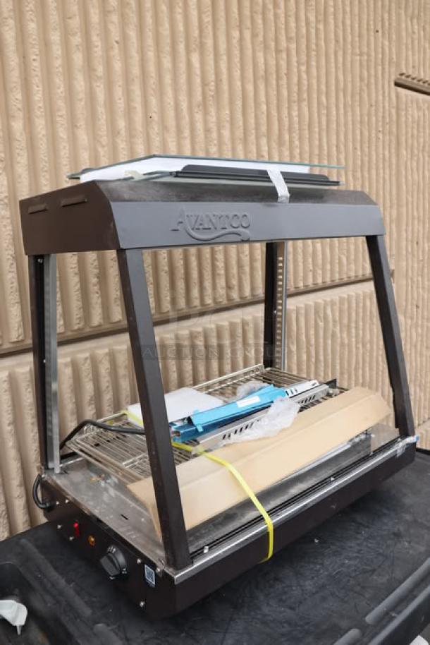 Brand new Avantco HDC-26 heated display case, 3 shelves, sliding doors, 26", bent frame, 120V, 1580W, S/N: CK-250210R-687.