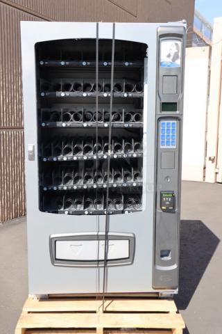 Seaga ENV5S vending machine with shattered front glass, 40-item capacity, ambient, 115V, 4 Amps, 1 Phase, serial E5S112502117.