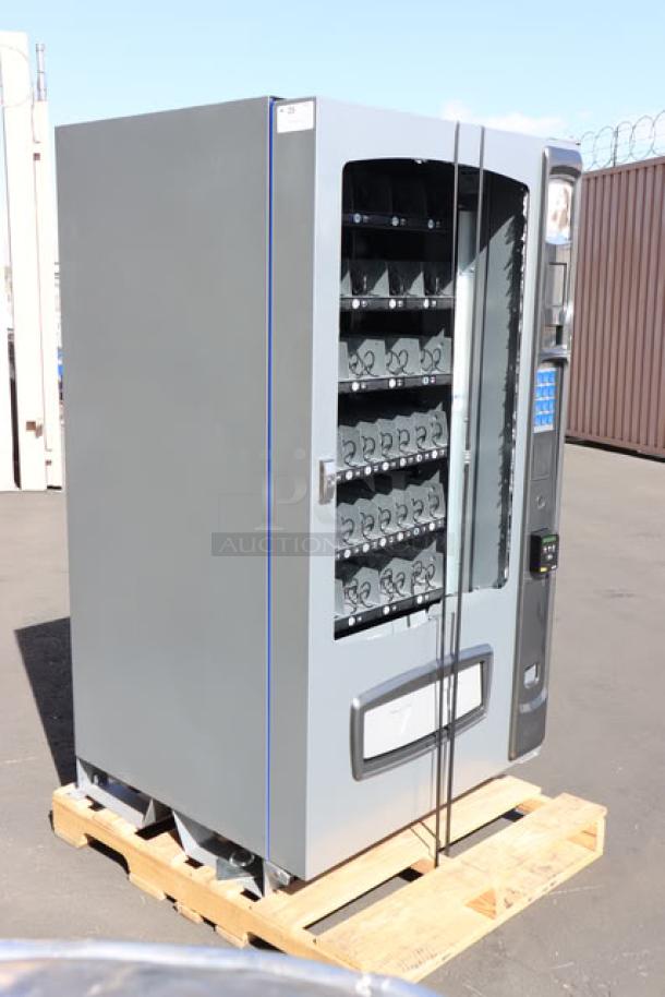 Seaga ENV5S vending machine, 40-item capacity, ambient temperature, front glass shattered, model ENV5S, S/N: E5S112502117.