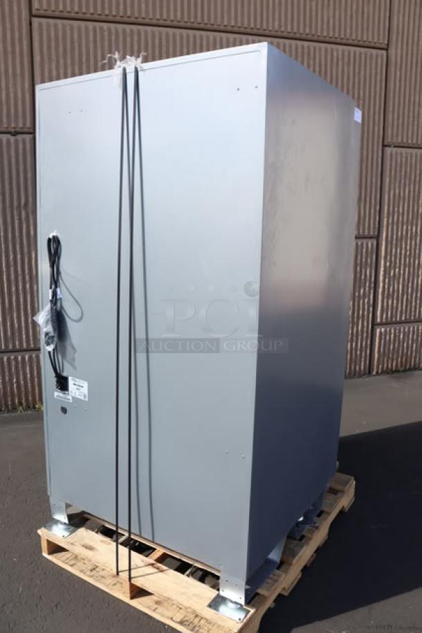 Seaga ENV5S vending machine, brand new, 40-item capacity, 115V, 4A, 1 Phase. Back view, front glass shattered.