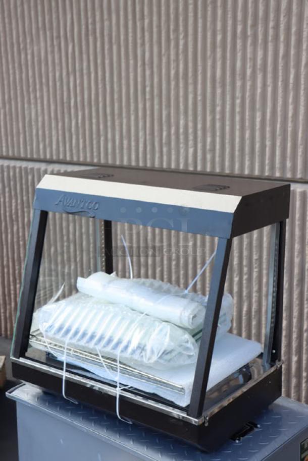 Avantco HDC-26 heated display case, 26", 3 shelves, sliding doors, 120V, 1580W, new scratch-n-dent condition.