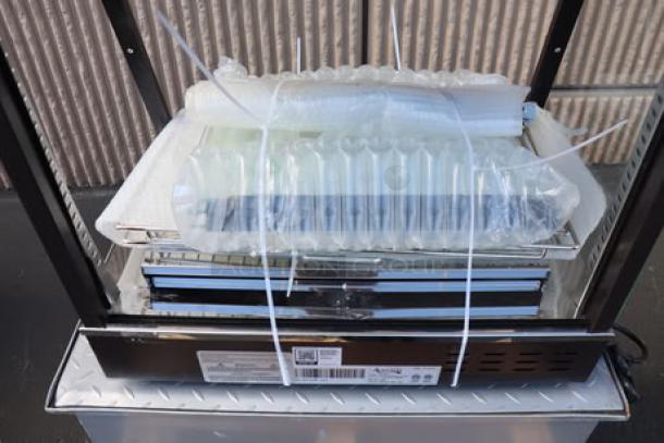 Avantco HDC-26 heated display case, 26" countertop, 3 shelves, sliding doors, scratch-n-dent condition, 120V, 1580W.