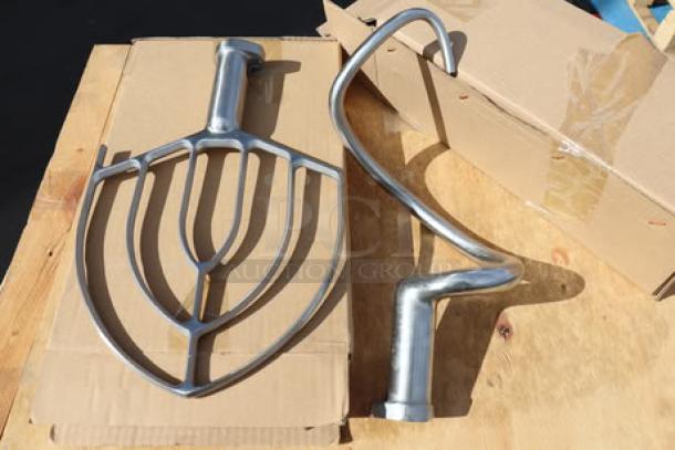 Avantco MX20H stand mixer attachments displayed on cardboard, new condition, includes flat beater and dough hook.