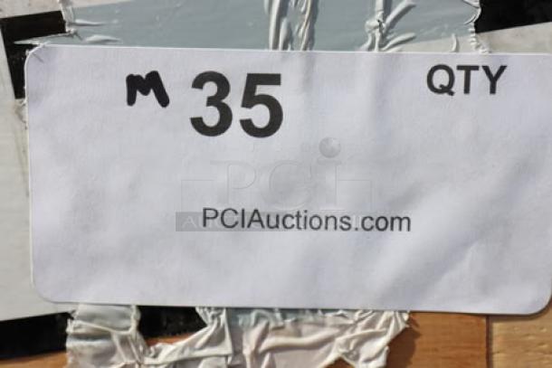 Sticker with "M 35 QTY" and "PCIAuctions.com" on a crate, indicating auction item details.