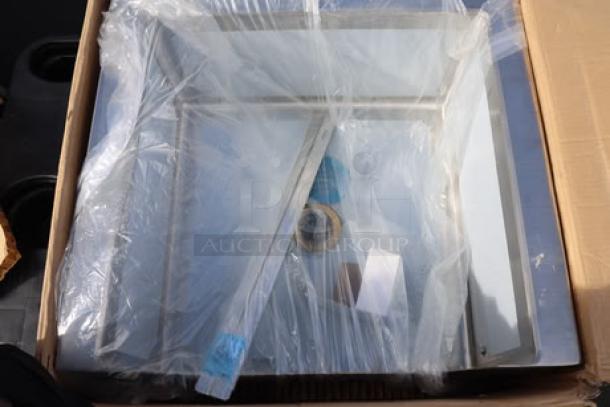 Brand new Regency 600SM242412N 16-gauge stainless steel mop sink, 24"x24"x12" bowl, notched front, in packaging.