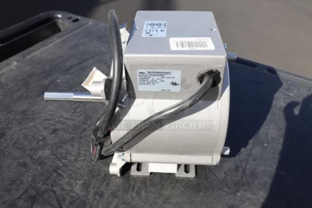 Brand new Blodgett 32291 motor, 1/3hp, 115v, 2-speed, out of packaging, visible label with specifications.