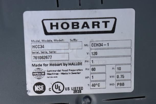 Label on Hobart CCH34-1 food processor showing model, serial number 761062677, 120V, 1 phase, made in Sweden.