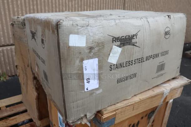 Regency 600SM16206 mop sink in damaged original packaging on pallet; model and brand labels visible.