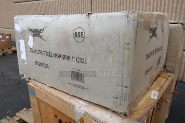 Brand new Regency 600SM16206 stainless steel mop sink in original, damaged packaging. Measures 25" with a 20"x16"x6" bowl. Box shows NSF marking.