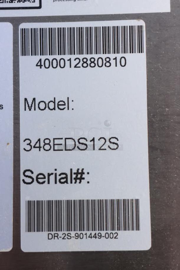 Brand new Estella EDS12S 12" dough sheeter tag, model and serial number DR-2S-901449-002 visible.