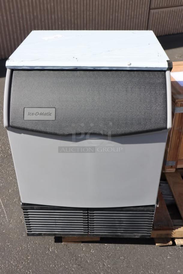 Brand new Ice-O-Matic ICEU220HA air-cooled ice machine, 238 lb capacity, with 70 lb bin; minor scratches.