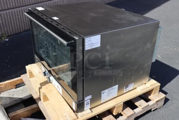 Cooking Performance Group COF-T4-M convection oven on pallet, stainless steel, 4 tray capacity, thermostat control, moisture injection.