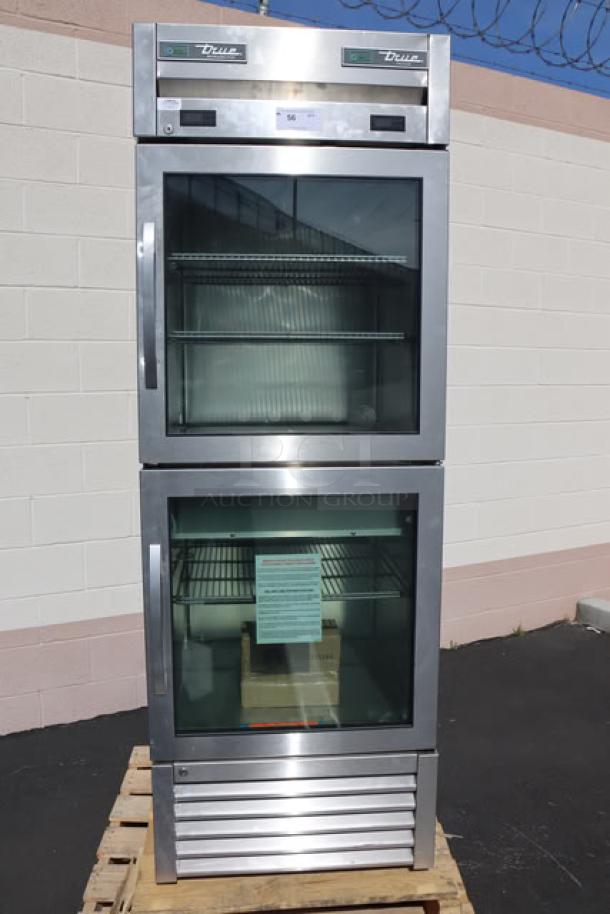 Brand new True T-23DT-G-HC~FGD01 combination refrigerator/freezer with glass half doors, adjustable shelves, minor cosmetic wear.