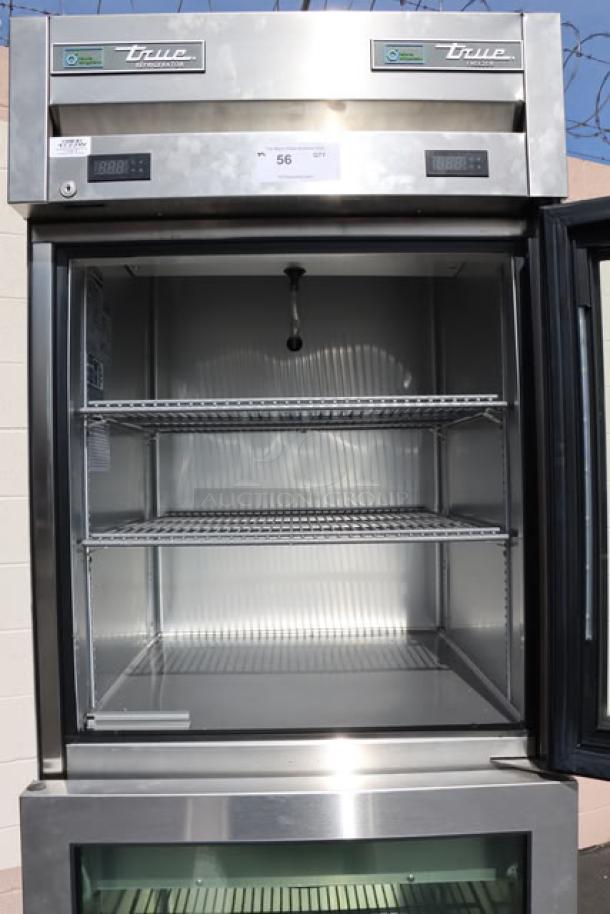 True T-23DT-G-HC~FGD01 glass half door reach-in combo fridge/freezer. PVC shelves, minor scuffs. Model/serial labels visible.