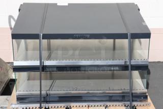 Brand new ServIt OAM-121D 42" heated display merchandiser, slanted 2-shelf, 1860W, 120V, no original packaging.