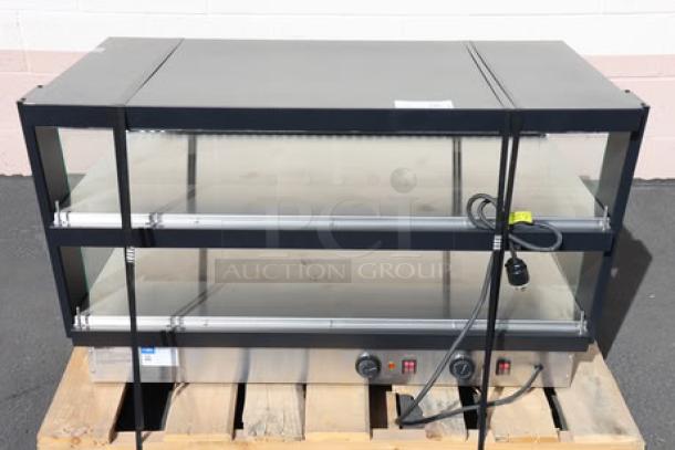 Brand new ServIt OAM-121D 42" slanted 2-shelf heated display merchandiser, 1860W, 120V, out of packaging, on pallet.