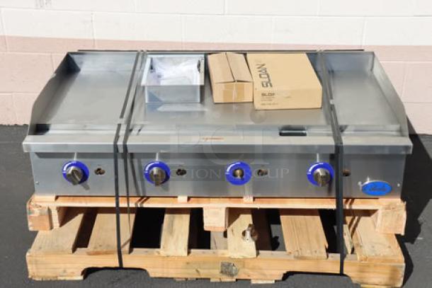 Brand new Globe GG48G 48" countertop gas griddle, 120,000 BTU, missing a knob, minor scratches/dents, on wooden pallet.