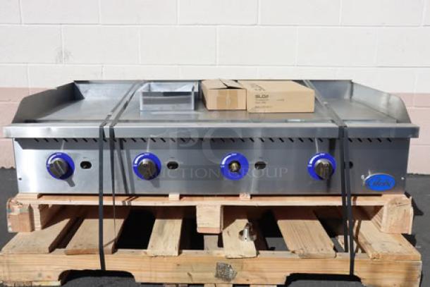 Brand new Globe GG48G 48" gas griddle on pallet. Missing one knob, original packaging destroyed. Minor scratches/dents.