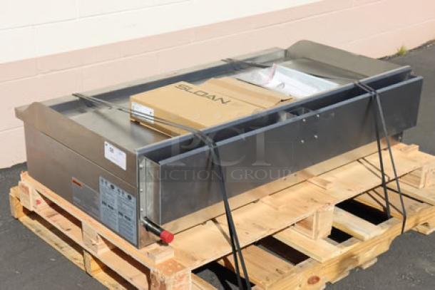 Brand new Globe GG48G 48" countertop gas griddle, 120,000 BTU. Missing knob, minor scratches/dents. S/N: 1625010562.