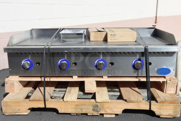 Brand new Globe GG48G 48" countertop gas griddle, 120,000 BTU. Missing one knob, minor scratches/dents. S/N: 1625010562.