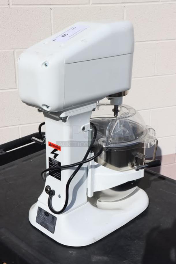 Brand new Globe SP08 8 Qt. countertop mixer with bowl lift, guard, and accessories; 120V, 1/4 hp, S/N: 7025626.