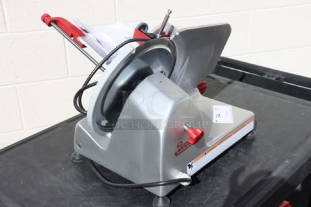 Berkel B10-SLC meat slicer, 10" blade, light-duty, 1/4 hp, 115V, new with scratches, serial EN-1109193, red and gray finish.