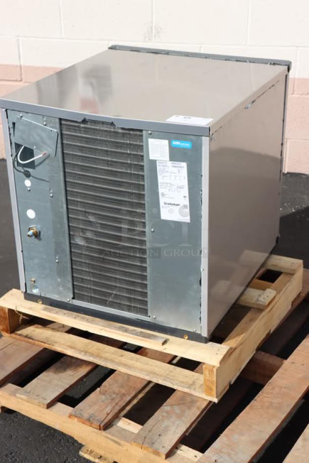 Scotsman Prodigy Plus NS0422A-1B nugget ice machine on pallet, silver finish, model label visible.