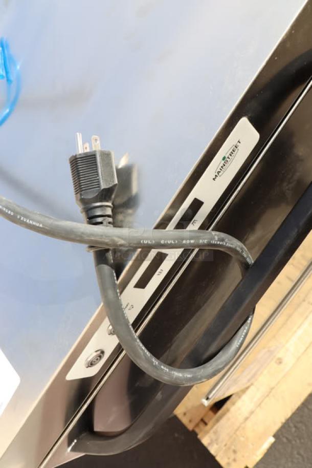 Brand new MainStreet Equipment HTUC high-temperature undercounter dishwasher, 208V/240V, 1 Phase, visible cord, minor scuffs.
