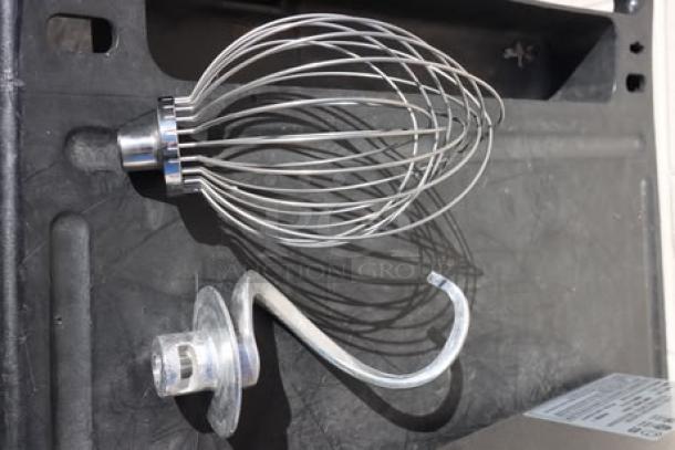 Stainless steel whip and dough hook attachments for Hobart N50-60 mixer, unboxed, with minor scuffs.