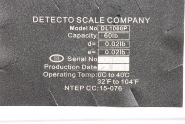 Label of Cardinal Detecto DL1060P digital scale, showing model, 60 lb capacity, and operating temperature details.