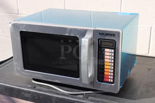 Brand new Solwave EM025FJT-S0SA00 stainless steel commercial microwave, 1,000 watts, push button controls, S/N: 250803637.
