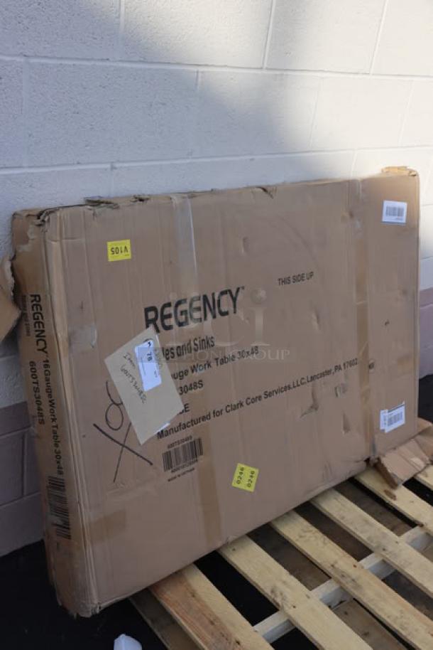 Regency work table box with markings, model 600TS3048S. Box shows signs of wear; table is 30"x48" stainless steel.