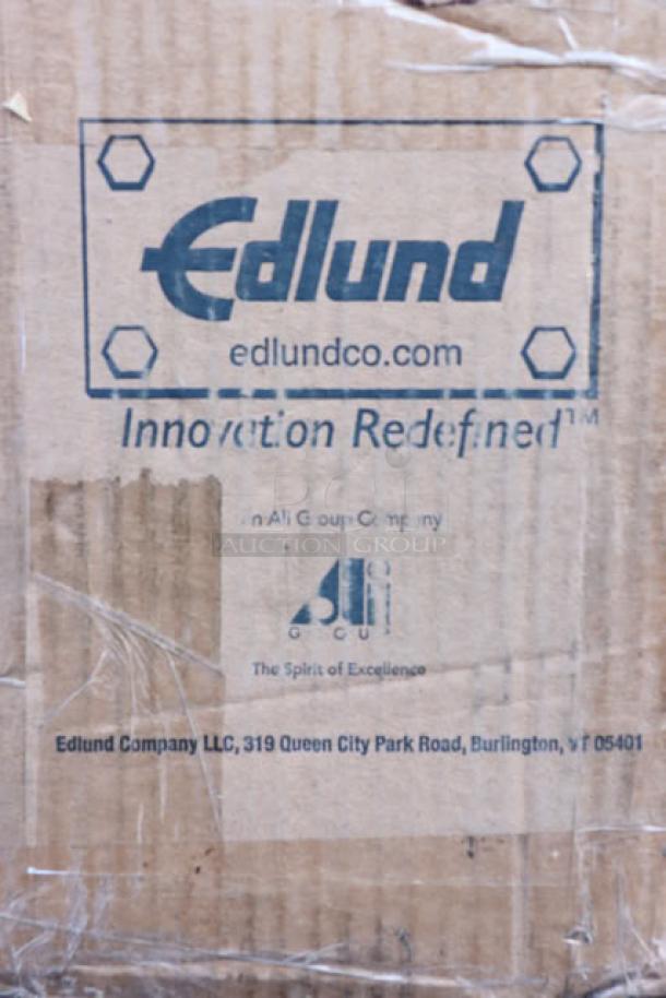 Brand new Edlund 203 two-speed tabletop electric can opener, S/N: 111749, in damaged original packaging.