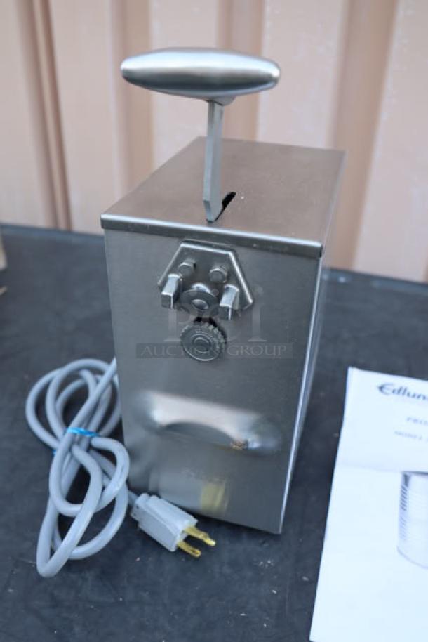 BRAND NEW Edlund 203 electric can opener, tabletop model, two-speed, stainless steel, 115V, power cord attached, original packaging damaged.