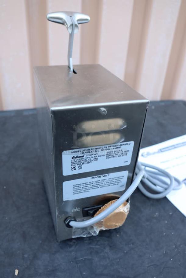 BRAND NEW! Edlund 203 two-speed tabletop electric can opener, 115V, S/N: 111776. Original packaging damaged.