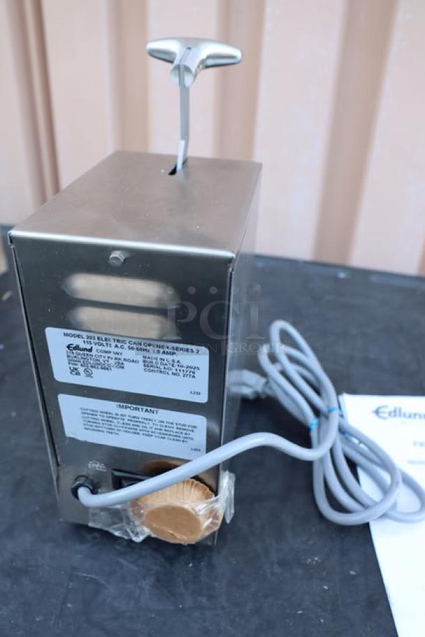 BRAND NEW Edlund 203 Two-Speed Tabletop Electric Can Opener, 115V, with tags and labels visible. Original packaging damaged.