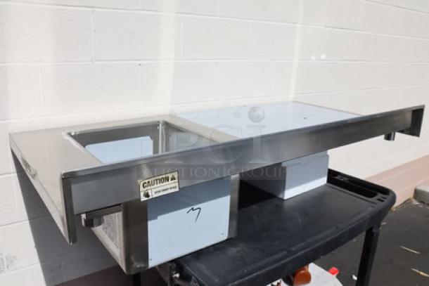 Regency 600STCB3060R 30" x 60" stainless steel work table with right sink, 16 gauge, new condition, caution label visible.