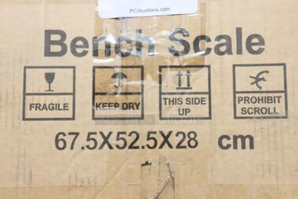 Packaging for Optima OP-915-RT-1818-400 bench scale, 400 lb. capacity, damaged state with handling instructions visible.