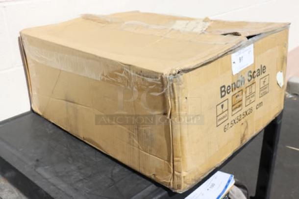 Damaged box of Optima Weighing Systems OP-915-RT-1818-400, 400 lb bench scale with roller top. Possible missing parts.