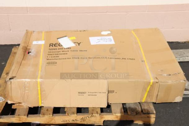 BRAND NEW Regency 30" x 48" stainless steel commercial work table in damaged packaging, model 600TSB3048S.