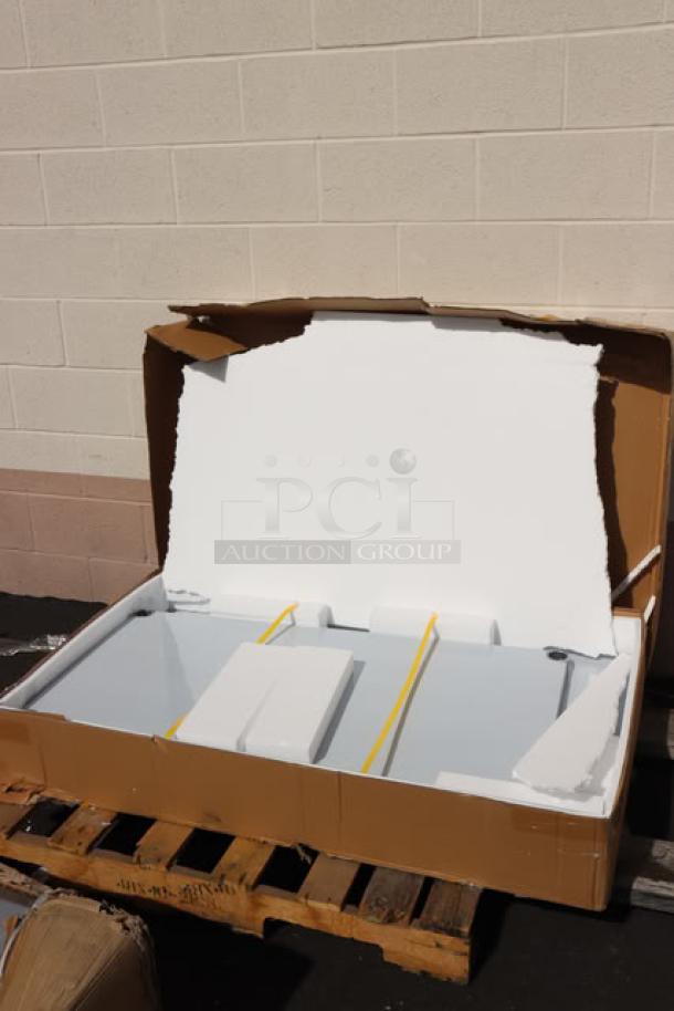 Brand new Regency 30" x 48" stainless steel work table, model 600TSB3048S, with damaged packaging; minor scuffs possible.