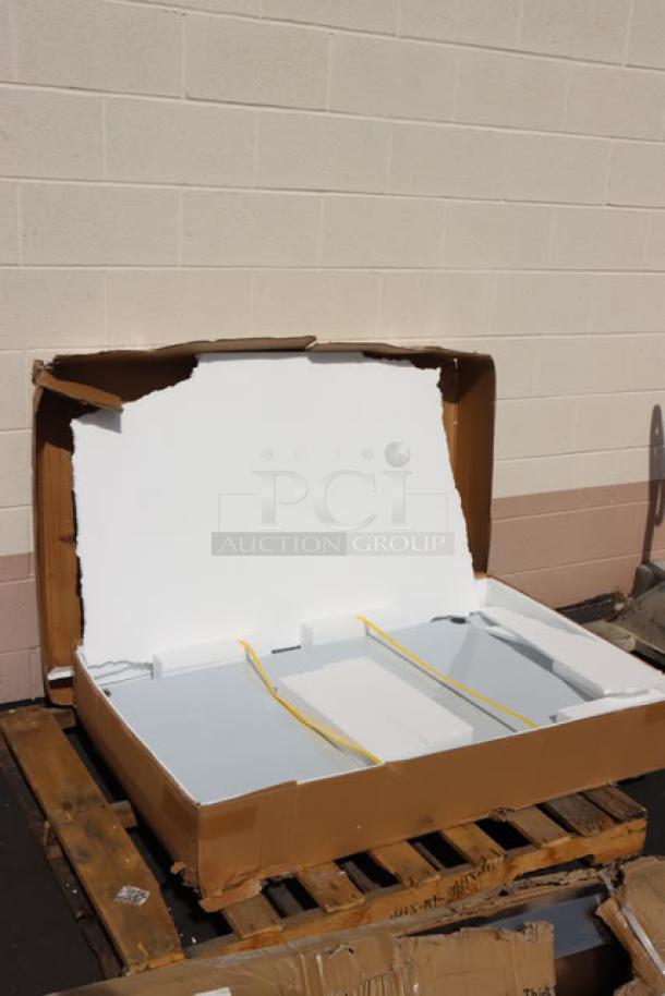 Regency 30" x 48" stainless steel work table in open damaged packaging; minor scuffs or dings possible. Model: 600TSB3048S.