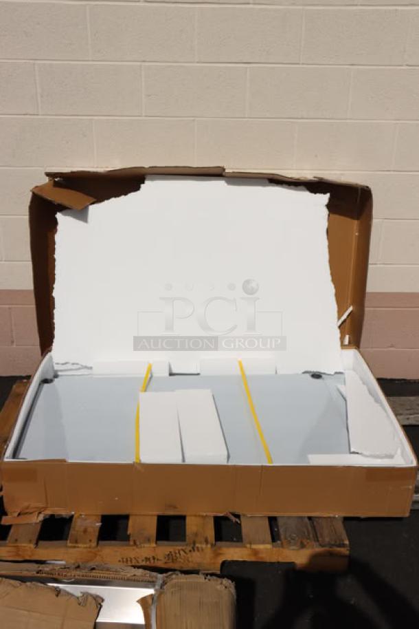 Regency 30" x 48" stainless steel work table, model 600TSB3048S, with 4" backsplash. Packaging damaged; minor scuffs/dings possible.