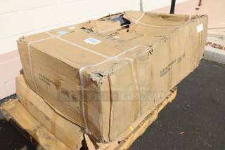 Brand new Regency CDT-48-L 16 Gauge 4' Clean Dish Table with left drainboard, sold as scratch-n-dent, shown in damaged packaging on a pallet.