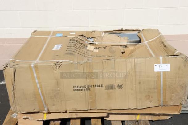 Brand new Regency CDT-48-L 16 Gauge 4' Clean Dish Table with left drainboard in damaged packaging, visible markings.