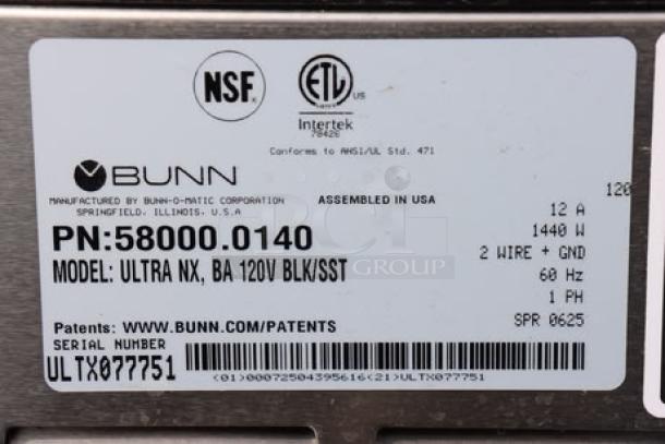 Alt text: "Bunn Ultra NX 58000.0140 label showing model, serial number ULTX077751, and specifications, out of packaging."