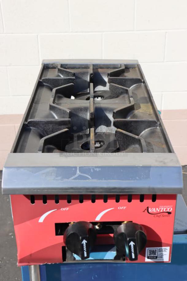 Brand new Avantco Chef Series CAG-R-2-12 gas countertop range with two burners, 50,000 BTU, minor scratches.