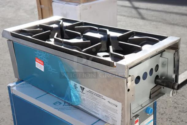 Brand new Avantco Chef Series CAG-R-2-12 12" 2 Burner Gas Range, 50,000 BTU, scratch-n-dent condition, visible labels.
