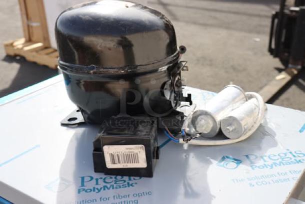 Brand new Avantco 17810035 compressor for SS-PT-71/APT-71, R-290, out of packaging, on fiber optic protection box.